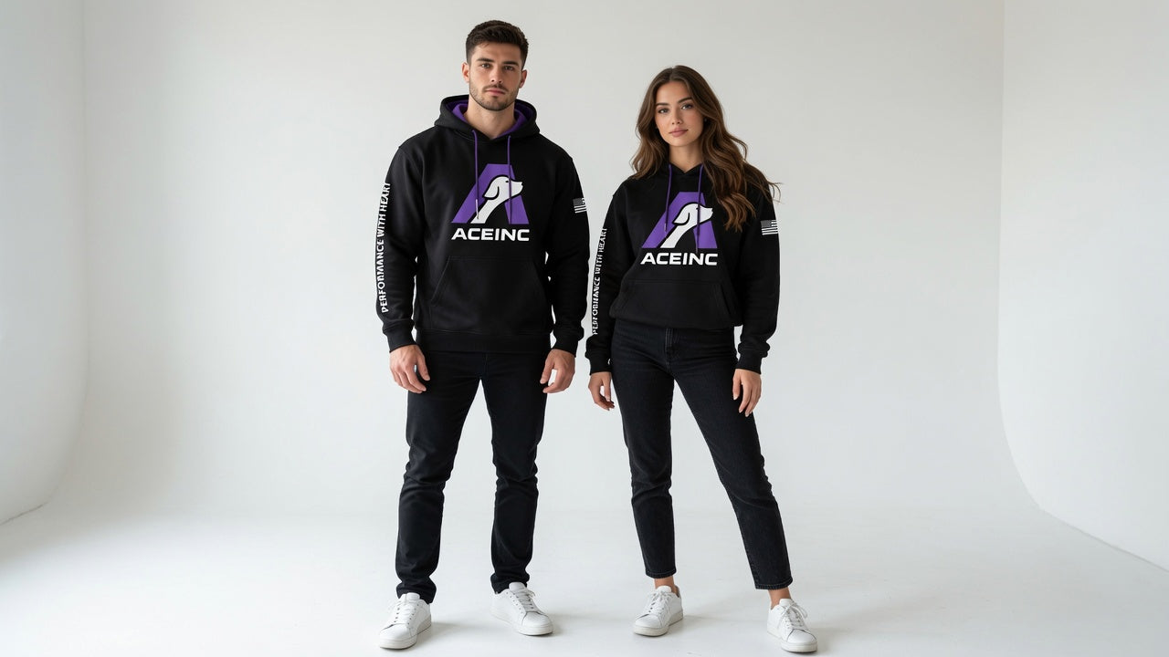 Man and woman wearing the ACE INC black pullover hoodie, showing fit on adult sizes
